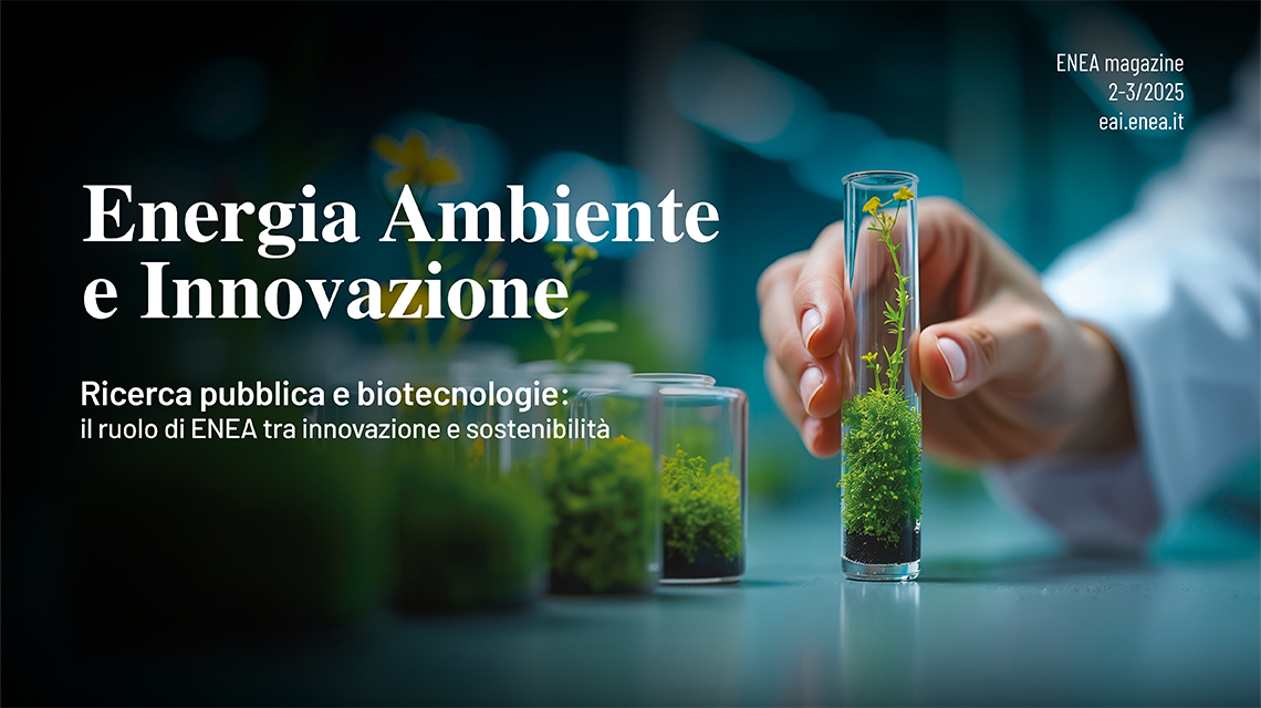 una mano che tiene una provetta con dentro delle piantine